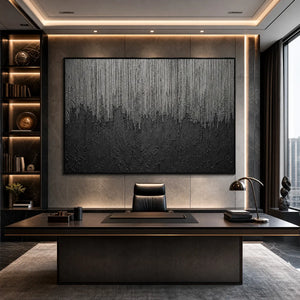 Large textured black and grey abstract wall art in a modern office
