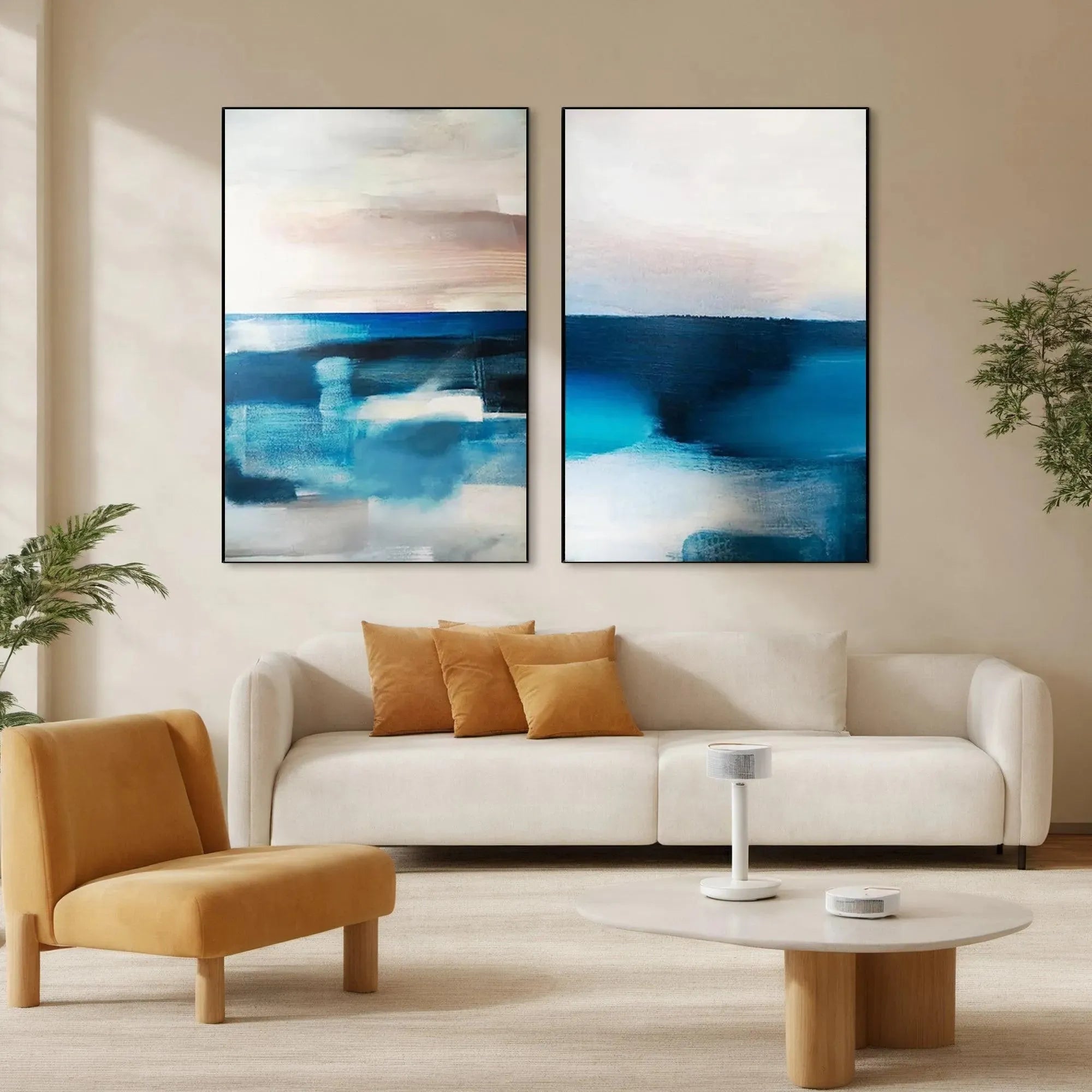 Two vertical abstract seascape paintings in blue and pink, by Willow Davies. Shown in living room.