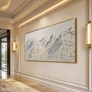 White textured mountain landscape oil painting in gold frame on elegant wall
