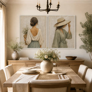 Neutral bohemian figurative diptych wall art in beige and sage green above a dining table