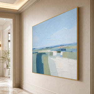 Textured abstract coastal landscape painting in blue, green, and white tones with gold frame
