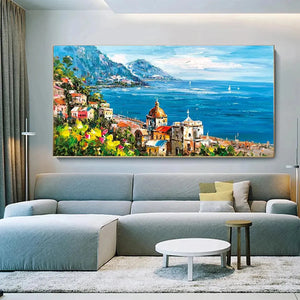 Impasto painting of Mediterranean town with red dome, colorful buildings, blue sea, mountains, in a living room.