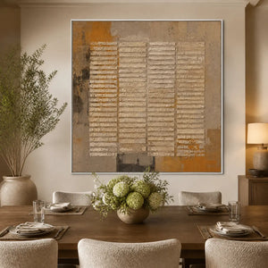 Rustic grid texture abstract wall art in earthy beige and brown tones in a white frame displayed in a refined dining room.