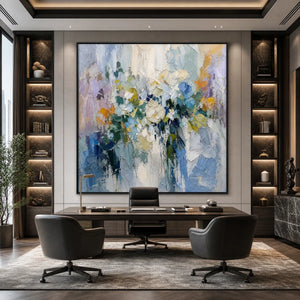 Large abstract floral textured oil painting in blue, white, lavender, green and yellow above a modern office desk