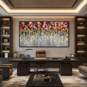 Colorful abstract floral impasto painting above modern office desk