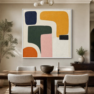 Modern organic shape abstract wall art with bold blue, yellow, green, pink and orange forms displayed in a refined dining room.