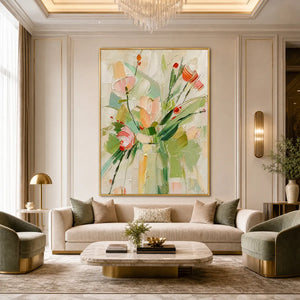 Textured impasto floral still life oil painting in a gold frame above a beige sofa