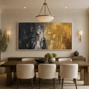Black and gold textured abstract wall art in a white frame displayed in a refined dining room.