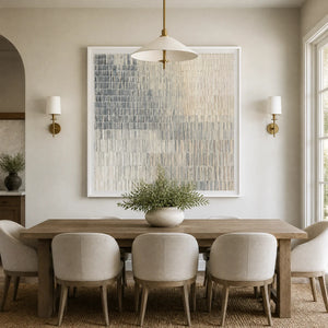 Modern abstract artwork with vertical patterns and blended colors, set in a bright, transitional dining room.