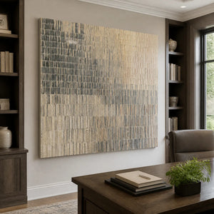 Textured abstract canvas art featuring vertical brushstrokes and neutral tones, hanging in a professional home office.