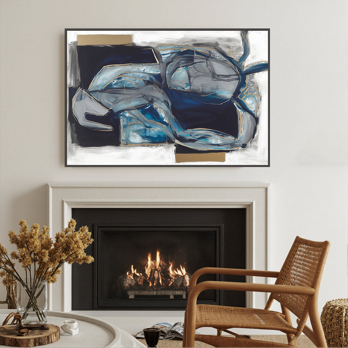 Abstract blue and white painting above a fireplace with a wicker chair and decorative items.