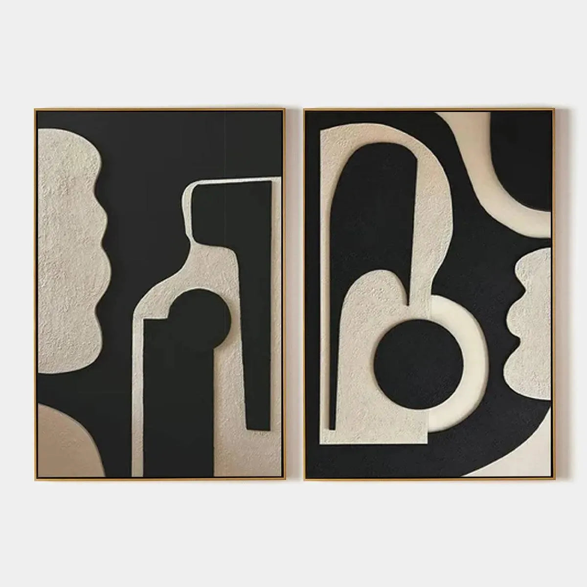 INK BLOT DUO: Set of 2 framed minimalist abstract paintings in black and beige with textured organic shapes.