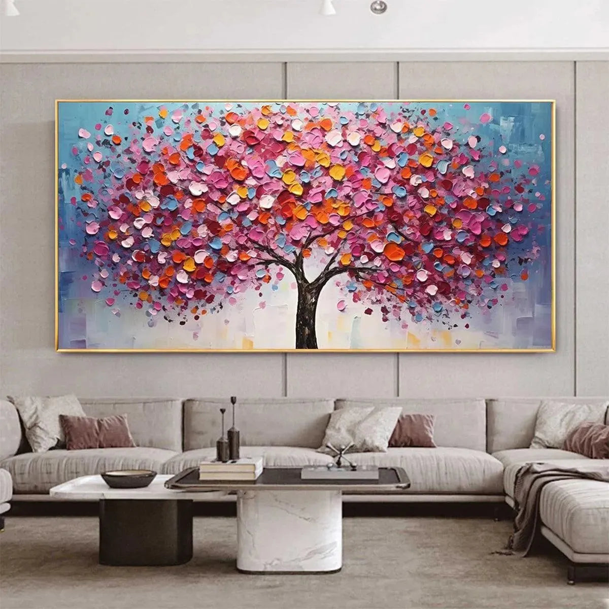 JEWEL TONES TREE: Textured impasto painting of vibrant pink, orange, blue, yellow tree leaves above sofa.