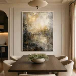 Moody gold and black abstract wall art above a modern dining table in a refined dining room.