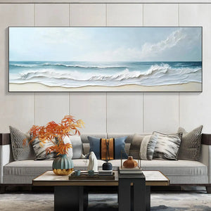 Liam O'Connell "Ocean Waves Panoramic" painting with textured impasto waves, displayed above a sofa in a living room.
