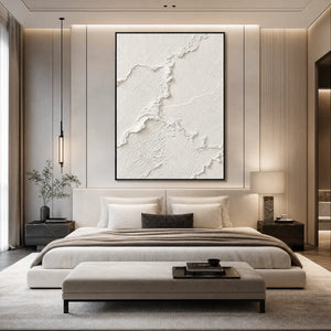 Textured white Wabi Sabi wall art above a modern beige bedroom bed