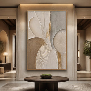 Textured abstract canvas art in wood frame, displayed in a luxury hotel lobby.