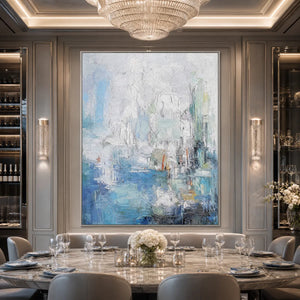 Textured abstract coastal city painting in blue and white above a luxury dining table