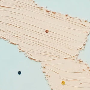 Modern wall art: Textured blush pink impasto painting with playful gold and blue accents.
