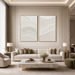 Two-panel minimalist textured Wabi Sabi wall art in white and gold above beige sofa