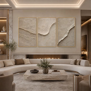 Textured beige Wabi Sabi wall art set of 3 above curved sofa in modern living room