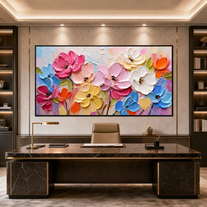 Colorful impasto floral oil painting with pink, blue and white flowers in a sleek office