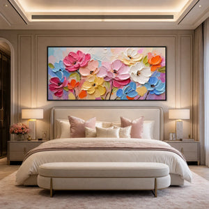Colorful impasto floral wall art above a modern beige bedroom bed