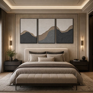 Textured minimalist abstract earth-tone triptych wall art above a neutral luxury bed