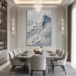 Textured abstract mountain climbers wall art in gray and blue over elegant dining room