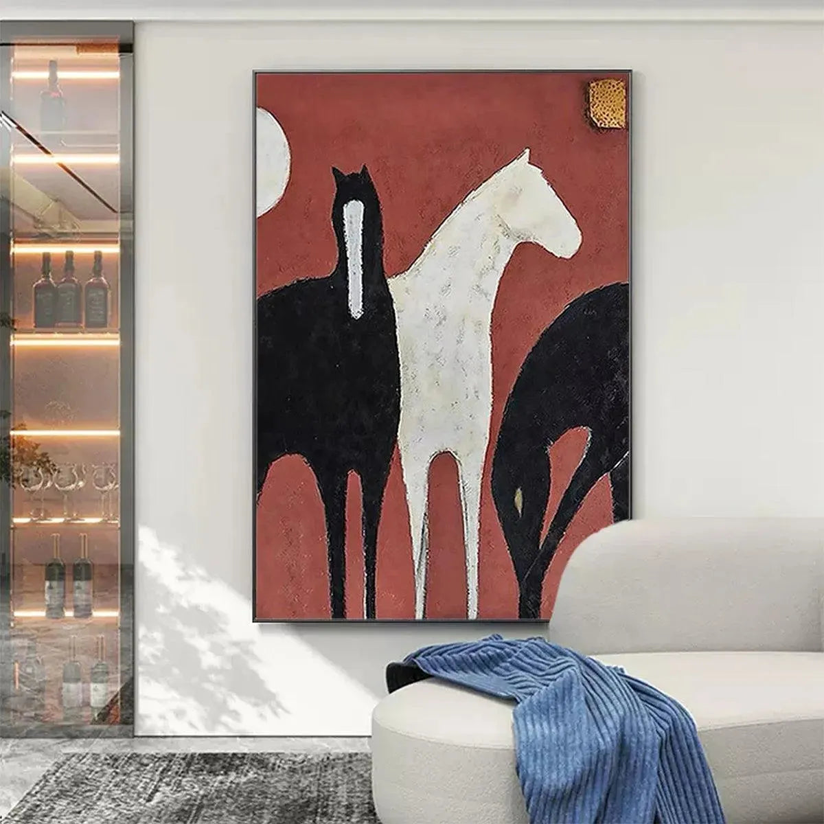 Minimalist vertical painting of three horses on textured red background, one white and two black, with gold accent.