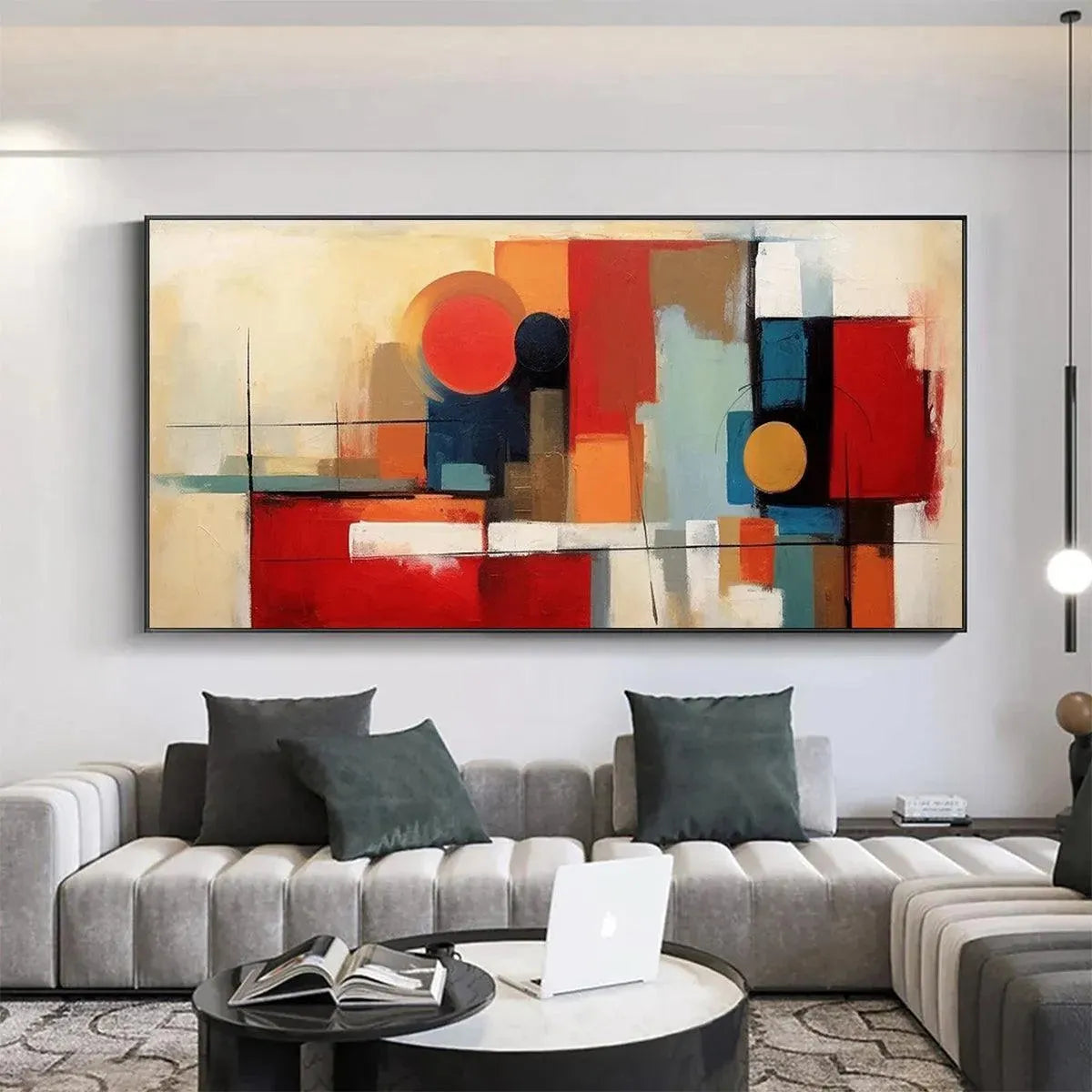 Urban Geometry abstract wall art with red gold geometric shapes above modern gray sofa in living room.