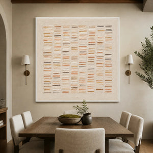 Warm beige geometric textured wall art with raised brushstroke grid displayed in a refined dining room.