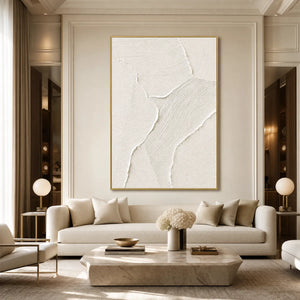 White textured Wabi Sabi abstract wall art in gold frame above cream sofa