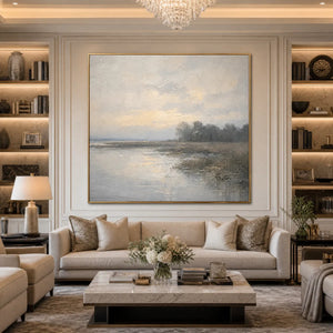 Textured Wabi-Sabi coastal landscape painting in soft beige and grey above a beige sofa