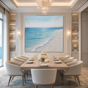 Textured minimalist beach scene wall art in blue and white over elegant dining room table