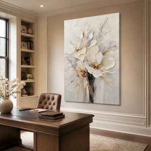 White bloom flower painting, textured white petals with beige-gold accents in a modern office.