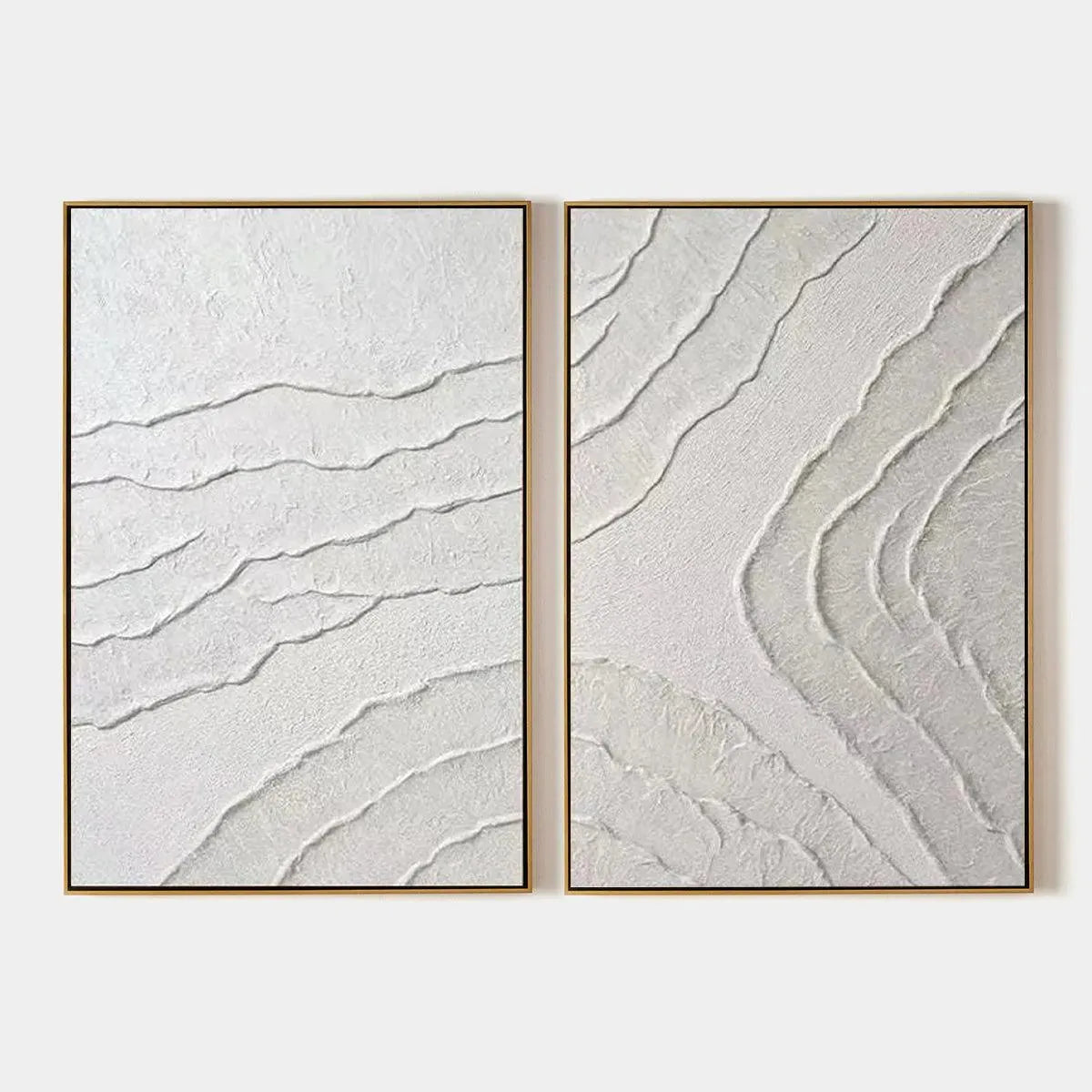 White Textured Lines Diptych by Isabella Rossi, abstract textured white lines on canvas, gold frame. Modern wall art.