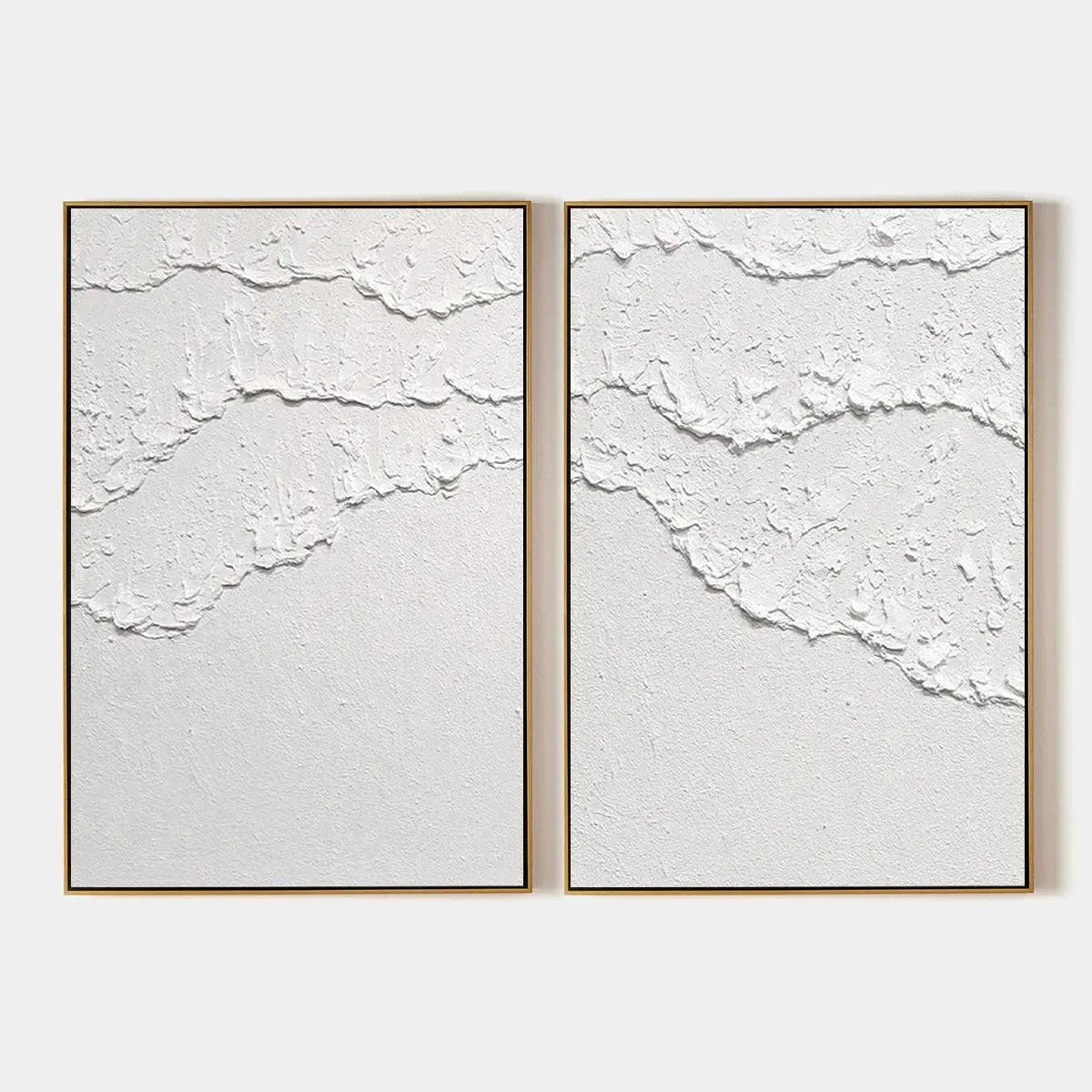 White Textured Waves Diptych by Isabella Rossi, abstract wall art. Textured white impasto on canvas with gold frame.