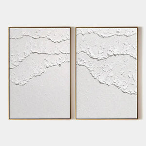 White Textured Waves Diptych by Isabella Rossi, abstract wall art. Textured white impasto on canvas with gold frame.