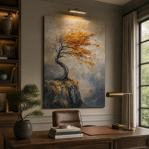 Textured oil painting of a windswept autumn tree on a cliff, displayed in a professional home office interior.