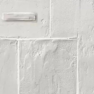 White Textured Squares Diptych by Javier Ramirez: Close-up of textured white minimalist painting detail, vertical wall art.