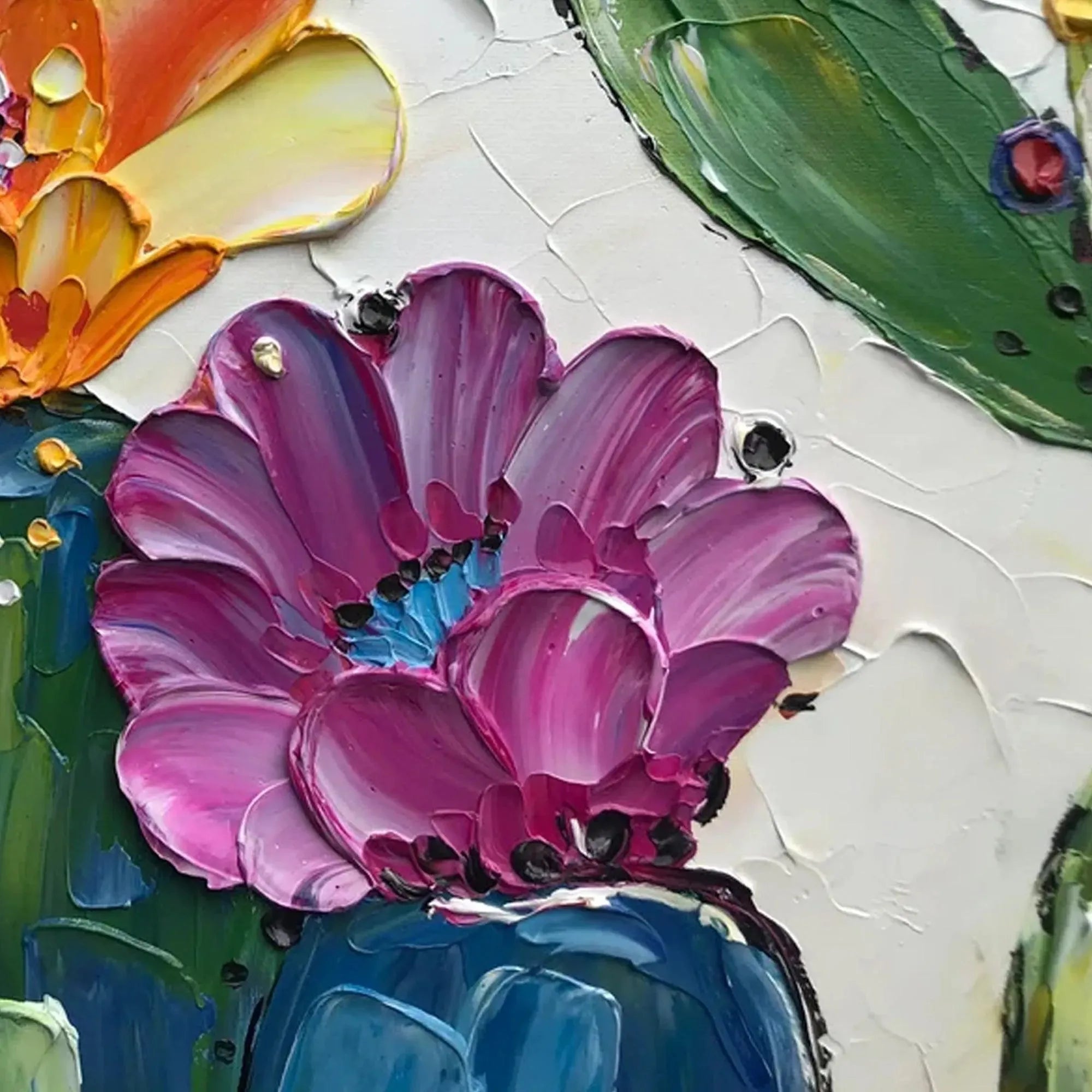Textured impasto cactus flower painting with vibrant fuchsia bloom and blue center on white canvas.