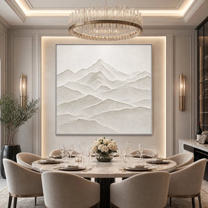 Textured minimalist mountainscape wall art in off-white tones above a luxury dining table