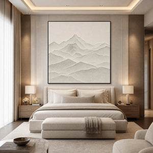 Textured minimalist mountain wall art in neutral tones above a modern bedroom bed