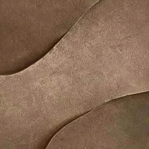 Close-up of brown textured abstract painting with coarse, swirling lines, showcasing earthy elegance. By Javier Ramirez.