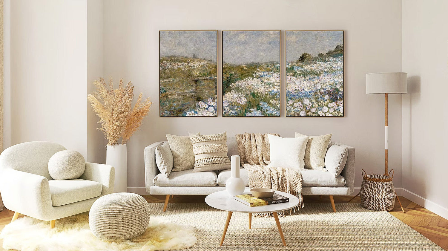 Mont Cart boho living room with a neutral sofa and a triptych of Impressionist floral landscape paintings.