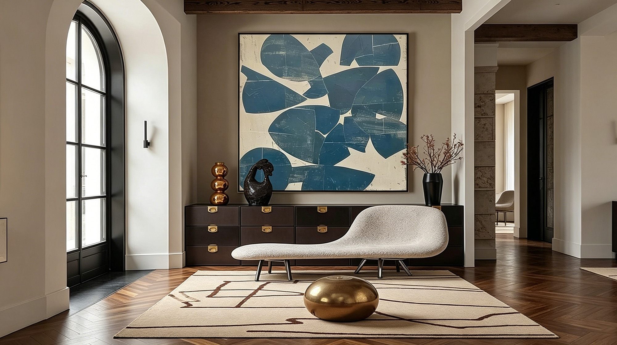 Blue abstract wall art above a console in a modern living room