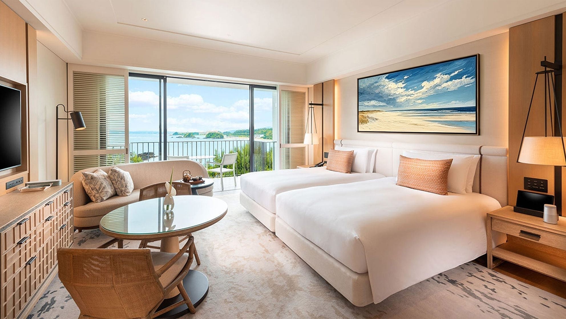 Luxury hotel room with a framed beach painting above two beds