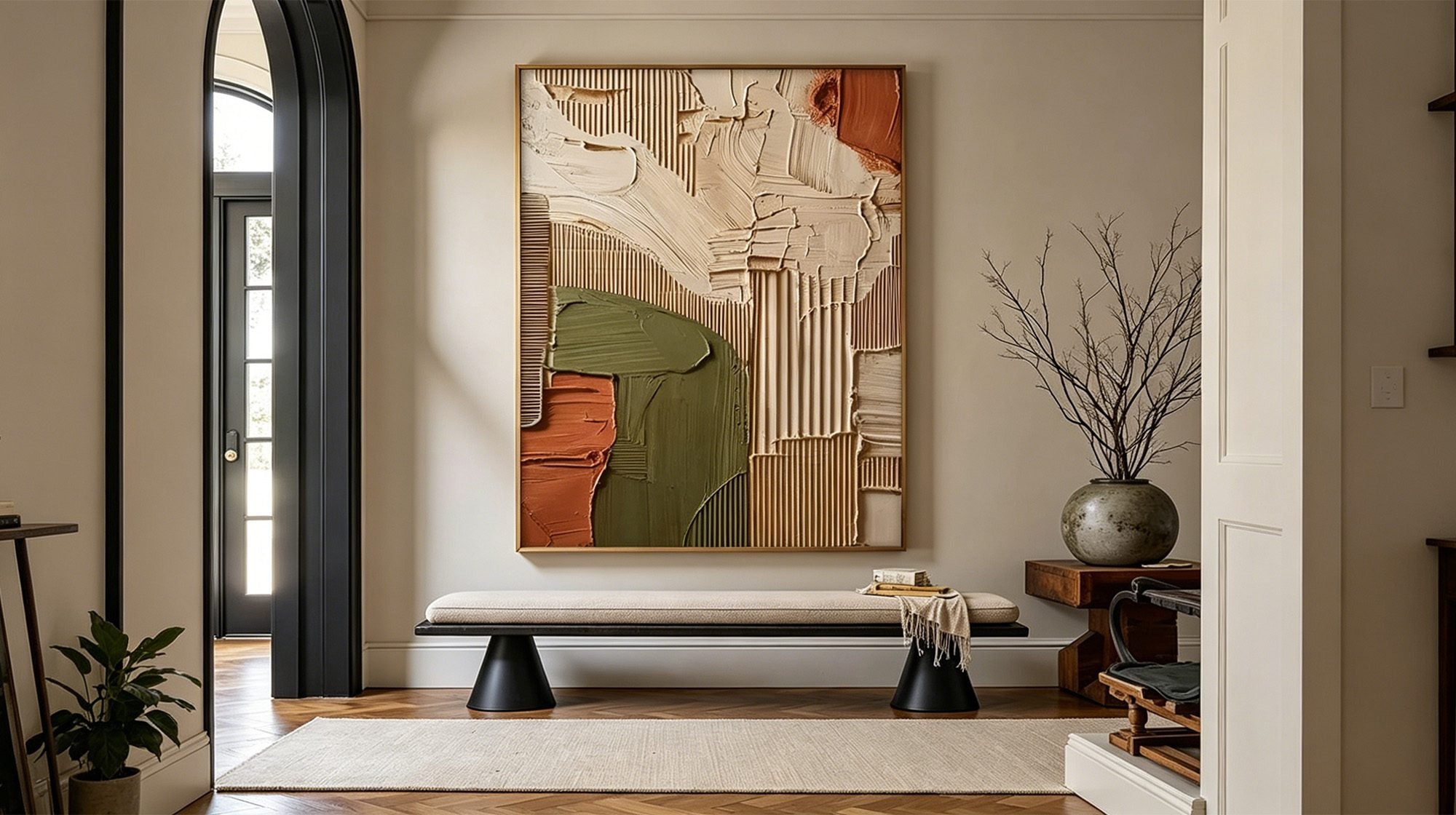 Textured abstract painting with warm earth tones in a modern entryway