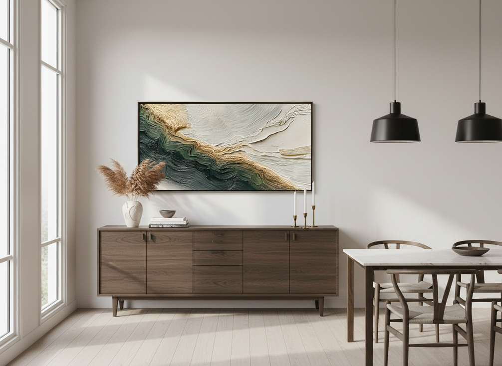 Textured abstract landscape art above a dining room buffet in warm evening light